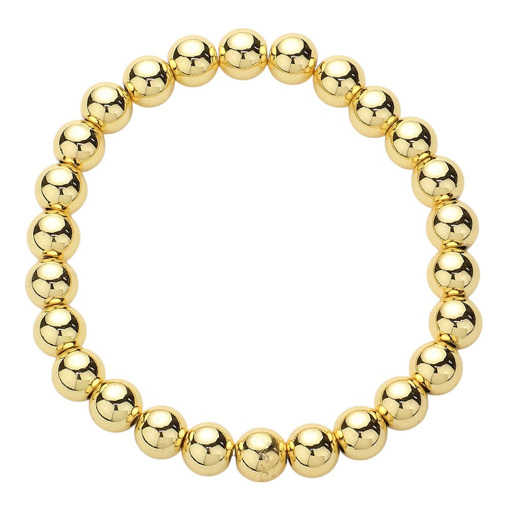 Gold Stainless Steel ball-beaded stretch Bracelet is made with durability and style in mind. The stainless steel material provides long-lasting wear, and the beaded design adds a touch of elegance. Perfect for any occasion, this bracelet effortlessly elevates any look.
