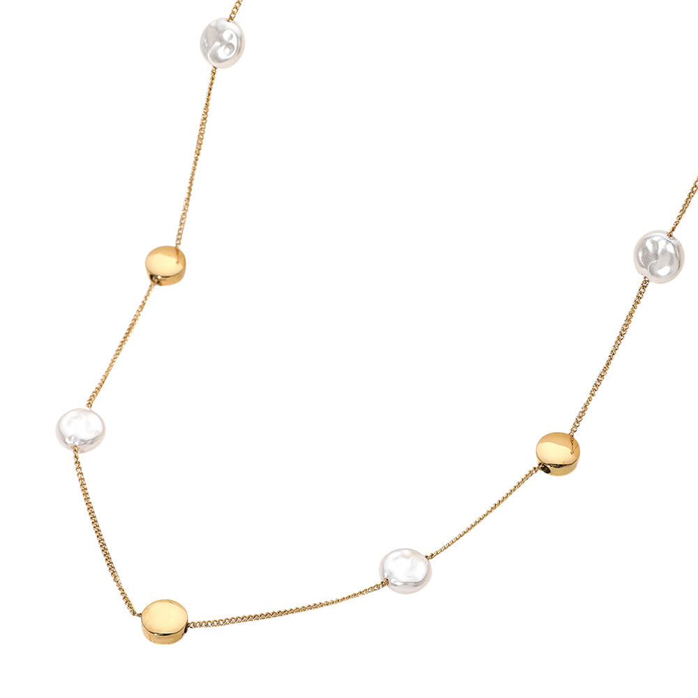 Gold Stainless Steel Disc Pearl Disc Station Necklace is a sophisticated addition to any jewelry collection. Crafted from durable stainless steel, it features a unique combination of disc-shaped and pearl stations, creating a modern and elegant look. With its high-quality materials and timeless design, this necklace is sure to elevate any outfit. 