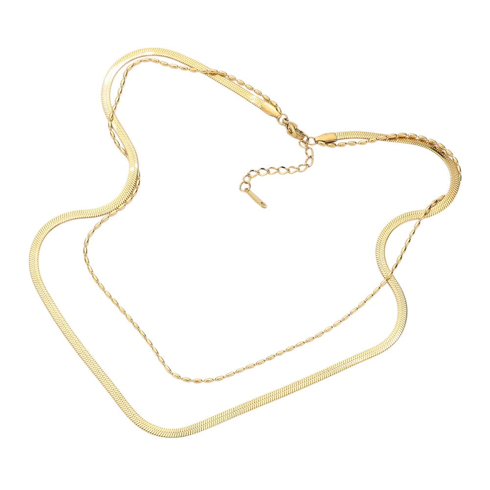 Gold Stainless Steel Herringbone Chain Layered Necklace offers a sleek and stylish addition to any outfit. Crafted from high-quality stainless steel, this necklace is durable and resistant to tarnishing. Its herringbone chain design adds a unique touch, making it a versatile piece for any occasion. Elevate your look with this modern and sophisticated accessory.