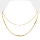 Gold Stainless Steel Herringbone Chain Layered Necklace offers a sleek and stylish addition to any outfit. Crafted from high-quality stainless steel, this necklace is durable and resistant to tarnishing. Its herringbone chain design adds a unique touch, making it a versatile piece for any occasion. Elevate your look with this modern and sophisticated accessory.
