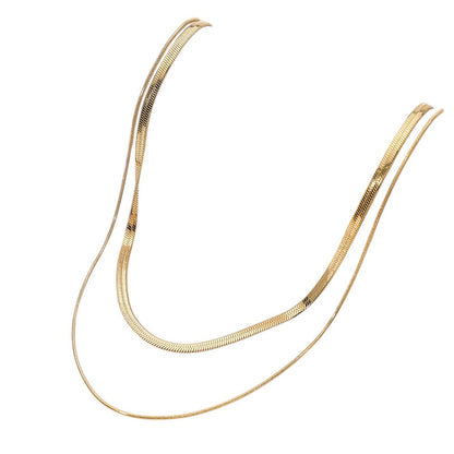 Gold stainless steel herringbone rope chain layered necklace is a versatile and stylish addition to your jewelry collection. Made with durable stainless steel, it offers a sleek and modern look that is perfect for both casual and formal occasions. Elevate your style with this statement piece.