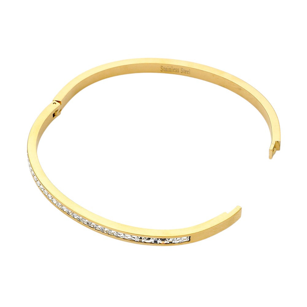 Gold Stainless Steel Rhinestone Paved Hinged Bangle Bracelet is durable and stylish for any occasion. Featuring a sleek stainless steel design and sparkling rhinestone accents, this hinged bangle is perfect for adding a touch of elegance to any outfit. With its sturdy construction and eye-catching design, this bracelet is a must-have for any fashion-forward individual.