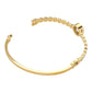 Gold Stainless Steel Round CZ Stone Bezel Hinged Bangle Bracelet. Made with high-quality stainless steel and featuring beautifully cut CZ stones in a bezel setting, this bangle adds a touch of elegance to any outfit. With a hinged design, it is easy to put on and take off for a comfortable fit. Elevate your style with this sophisticated accessory.