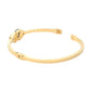 Gold Stainless Steel Stone Paved Handcuff Hinged Bangle Bracelet is the perfect combination of style and durability. Crafted with high-quality stainless steel and adorned with sparkling stones, this bracelet is sure to make a statement. The hinged design adds comfort and versatility. A must-have accessory for any fashion-forward individual.