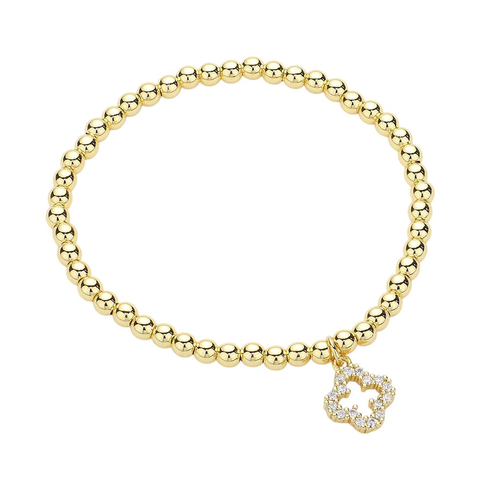 Gold Stainless Steel Stone Paved Open Quatrefoil Charm Stretch Ball Bracelet is a stylish addition to any outfit. Made with high-quality stainless steel, this bracelet boasts a unique stone-paved quatrefoil charm and a stretch ball design for a comfortable fit. Elevate your look with this elegant and durable piece.