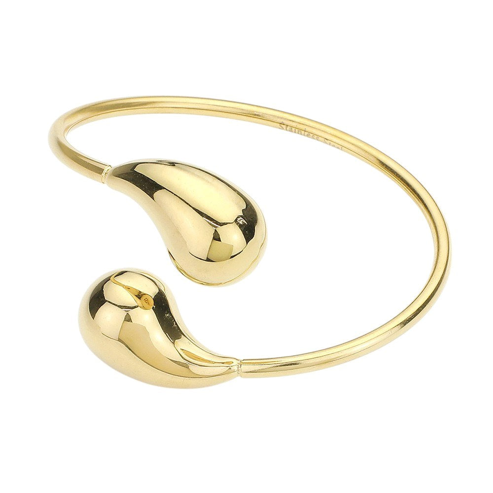 Gold Stainless steel teardrop tip wire bangle bracelet offers a sleek and modern design, perfect for any outfit. Made with durable materials, it is both stylish and long-lasting. Add a touch of elegance to your wardrobe with this stunning bracelet.
