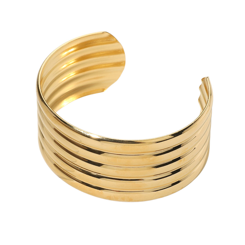 Gold Stainless Steel Wide Cuff Bracelet is expertly crafted with durable stainless steel. Its sleek and stylish design compliments any outfit, and its high-quality material ensures long-lasting wear. Perfect for everyday use or special occasions, this bracelet adds a touch of sophistication to any wardrobe.