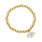 Gold Stone Paved Enamel Evil Eye Charm Stainless Steel Bubble Stretch Bracelet is a stunning and durable piece of jewelry. The eye-catching design features a stone paved enamel evil eye charm, providing both protection and style. Made from stainless steel, this bracelet is also hypoallergenic and resistant to tarnishing.