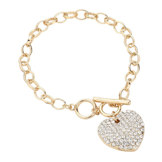 Gold Stone Paved Heart Pendant Metal Toggle Bracelet, is a must-have accessory for any fashion-forward individual. Exquisitely crafted to elevate any outfit, this bracelet is a unique addition to your jewelry collection. Its toggle closure ensures a secure fit and its elegant style will make you stand out from the crowd.