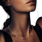 Gold Stone Paved VOTE Initial Message Station Necklace is a must-have for any politically motivated individual. Featuring a bold VOTE initial message, the necklace is adorned with sparkling stones, making it a beautiful statement piece. Show your support for your beliefs with this elegant and meaningful necklace.