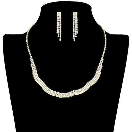 Gold Wavy Rhinestone Jewelry Set, features delicate rhinestones arranged in an elegant ribbon-like pattern, creating an eye-catching look. The light-catching stones add sparkle and shine to any ensemble and the wave adds an extra layer of beauty. Perfect for special occasions, this stylish set is sure to make a statement.