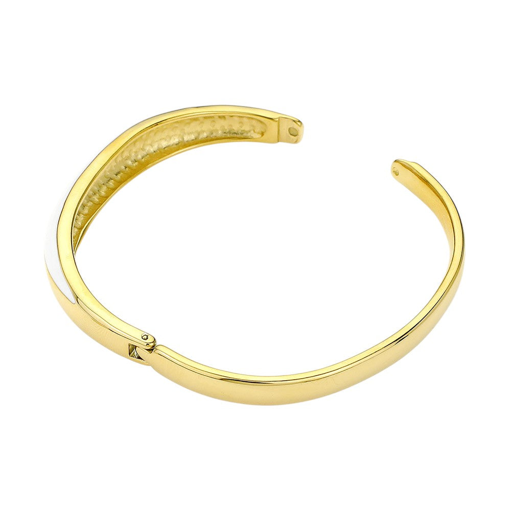 Gold White Stainless steel enamel hinged bangle bracelet is a sleek and durable addition to any jewelry collection. Made from high-quality stainless steel, it offers long-lasting wear and a touch of elegance to any outfit. The hinged design allows for easy wear and removal, making it a convenient and stylish choice for daily wear.