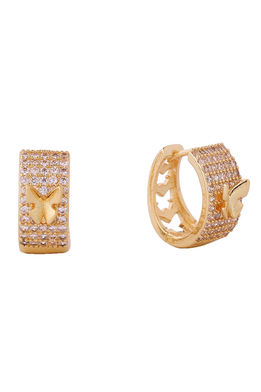 Gold Delicate butterfly huggie earrings crafted in 14K gold or white gold-dipped brass with sparkling cubic zirconia accents. These artistic designs measure 1.4cm and hug the earlobe beautifully. Hypoallergenic construction makes them perfect for sensitive skin. Lead and nickel compliant for safe, worry-free wear. Expertly made in Korea, these charming earrings blend elegance with comfort for everyday luxury.