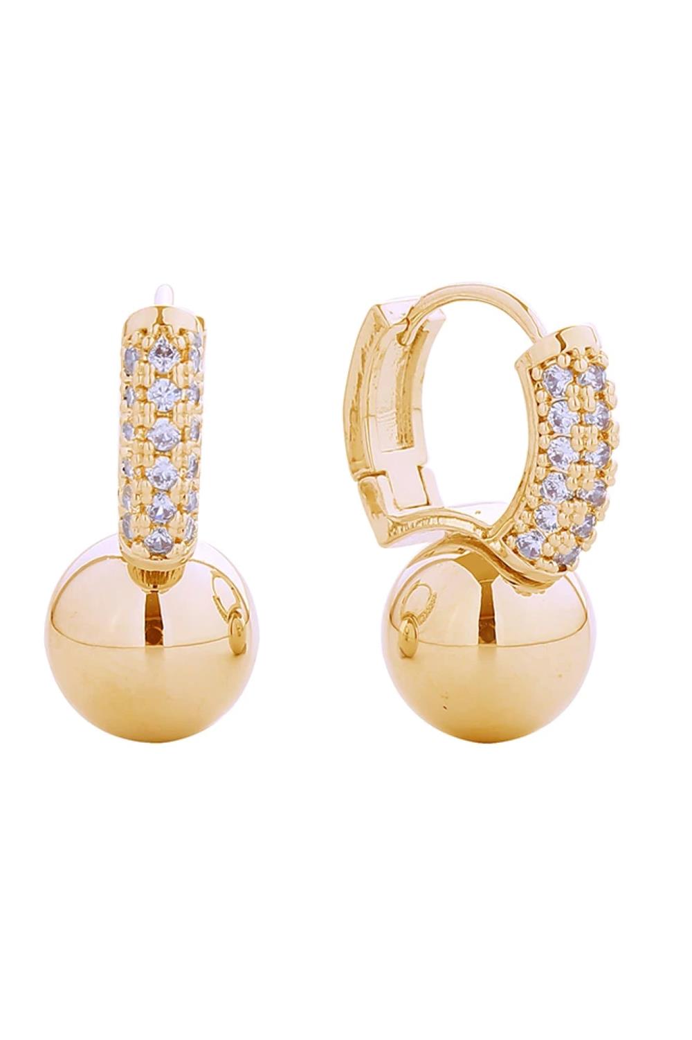 Gold Timeless huggie earrings with a graceful ball drop accent, embellished with sparkling pavé cubic zirconia. Constructed from hypoallergenic brass with 14K gold or white gold plating for an upscale look. The compact 1.7cm diameter sits comfortably close to the ear for an understated elegance.&nbsp;