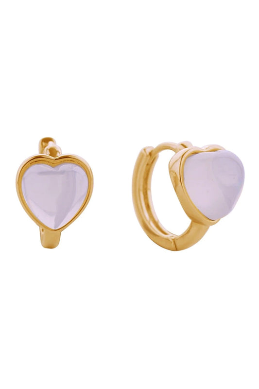 Gold Embrace timeless elegance with these 14K gold and white gold dipped heart huggie earrings. Crafted from hypoallergenic brass with captivating cat eye stone details, they're designed for sensitive skin and everyday comfort. Measuring 1.7cm in diameter, these petite huggies sit close to the ear for a refined, understated look.