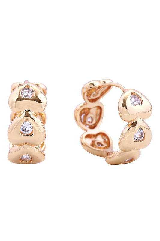 Gold Elegant 14K eternity heart huggie earrings crafted from hypoallergenic brass with sparkling cubic zirconia stones. These petite 2.2cm diameter earrings offer timeless sophistication with everyday wearability. Lead and nickel compliant for sensitive skin. Perfect for layering or wearing solo, these versatile huggies add a touch of luxury to any look.