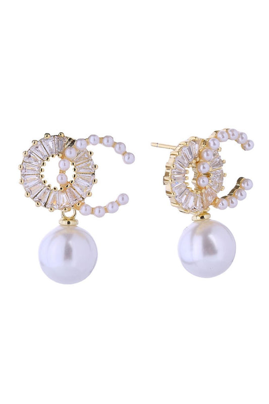 Gold Elegant pearl drop earrings crafted with 14K gold and white gold dipping for a luxurious finish. Featuring lustrous O-C pearls paired with sparkling cubic zirconia accents, these hypoallergenic posts are gentle on sensitive ears. Measuring 2cm, they offer the perfect balance of sophistication and wearability. 