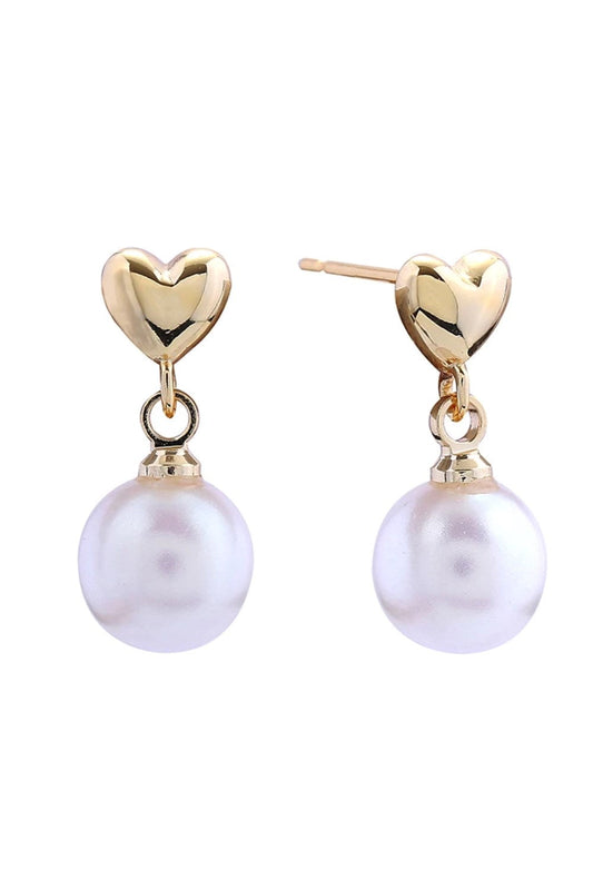 Gold Delicate pearly heart post earrings crafted in brass with 14K gold and white dipping. Each earring measures 1.6cm in diameter, offering a subtle yet elegant statement. Hypoallergenic design makes them perfect for sensitive skin. Lead and nickel compliant for safe, worry-free wear. An understated piece that transitions effortlessly from day to evening.