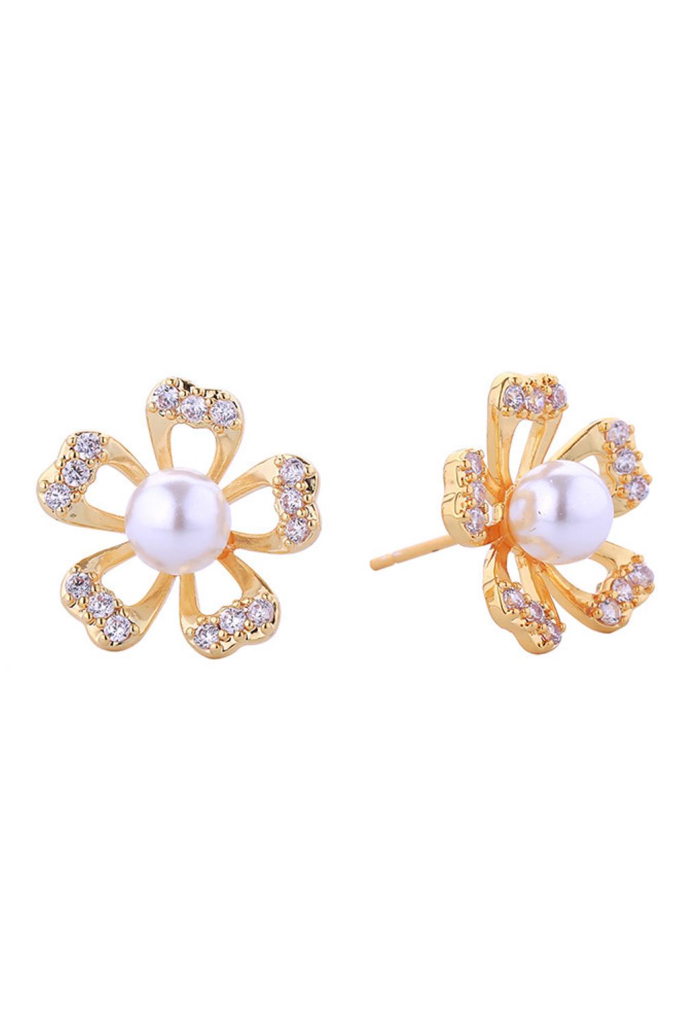 Gold Timeless pearl post earrings with delicate gold and white dipped petal detailing. Each piece combines lustrous pearls with sparkling cubic zirconia accents, set in hypoallergenic brass for sensitive ears. At 1.7cm diameter, they strike the perfect balance between statement and subtlety. Lead and nickel compliant for peace of mind. Ideal for layering or wearing solo, these versatile studs transition seamlessly from day to evening.