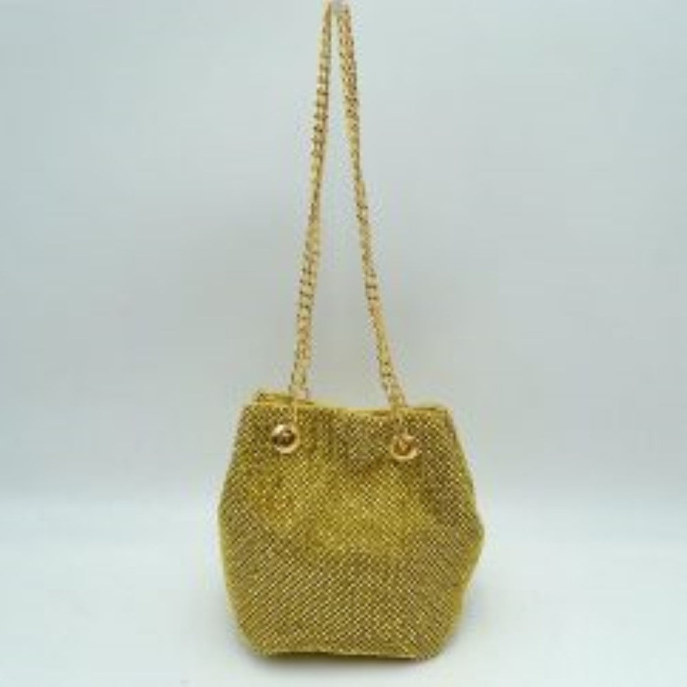 Gold This bucket bag features a shimmering, textured mesh exterior ideal for everyday use and evening transitions. The main storage compartment is designed with a gathered top entry that opens up for effortless access to your items. Two matching metallic link chain straps pull through circular metal grommets on the front and back, serving as a functional drawstring mechanism while doubling as a comfortable shoulder carry style.