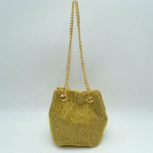 Gold This bucket bag features a shimmering, textured mesh exterior ideal for everyday use and evening transitions. The main storage compartment is designed with a gathered top entry that opens up for effortless access to your items. Two matching metallic link chain straps pull through circular metal grommets on the front and back, serving as a functional drawstring mechanism while doubling as a comfortable shoulder carry style.