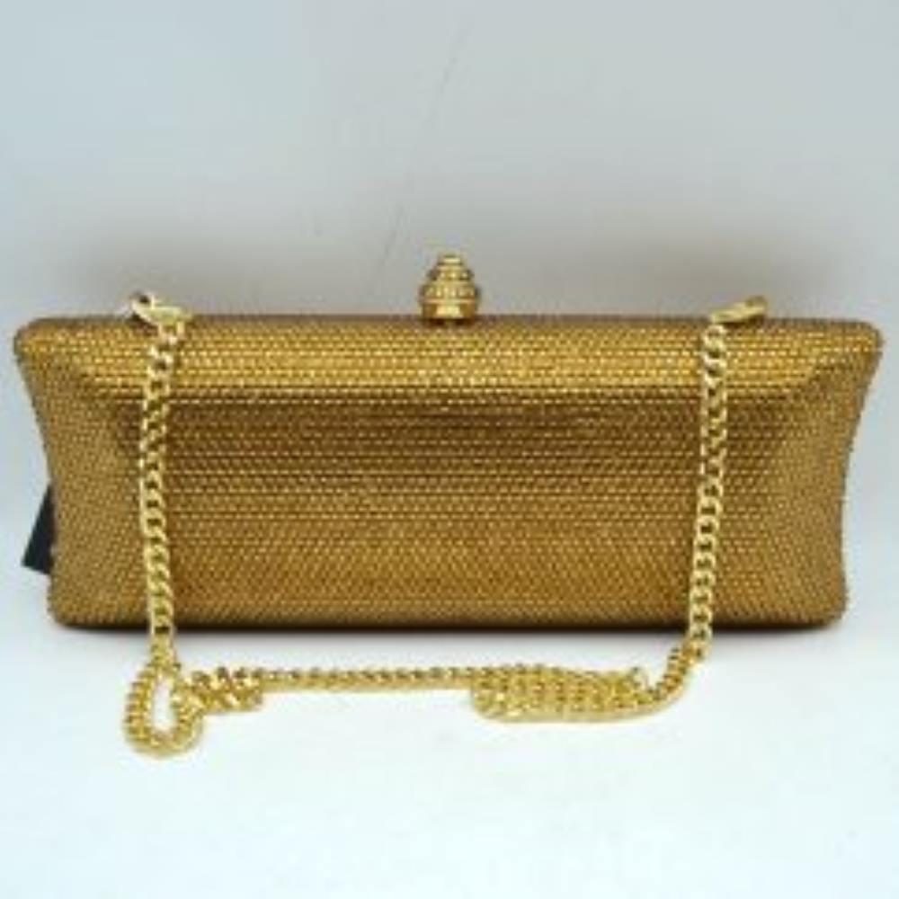 Gold This structured clutch bag features an elongated silhouette with subtly flared edges, completely covered in fine, glittering micro-embellishments that create a shimmering, textured surface suitable for elegant everyday use. The central storage compartment is securely accessed via a hard-frame opening with an ornamental, rounded top clasp. A long, slender metallic curb chain strap is permanently attached to the top loops