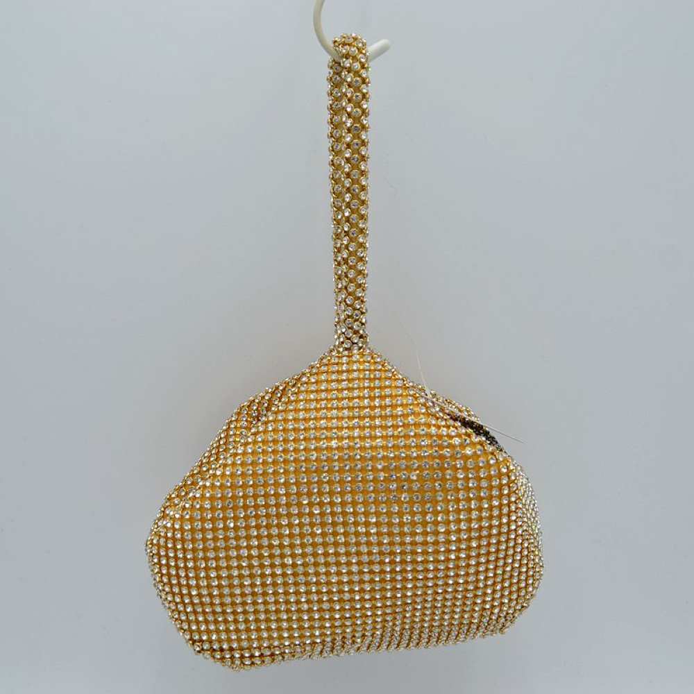 Gold Make a bold yet elegant statement with the shimmering evening pouch. Perfect for nights out, formal dinners, or special events, this unique wristlet infuses any outfit with instant texture and subtle sparkle.