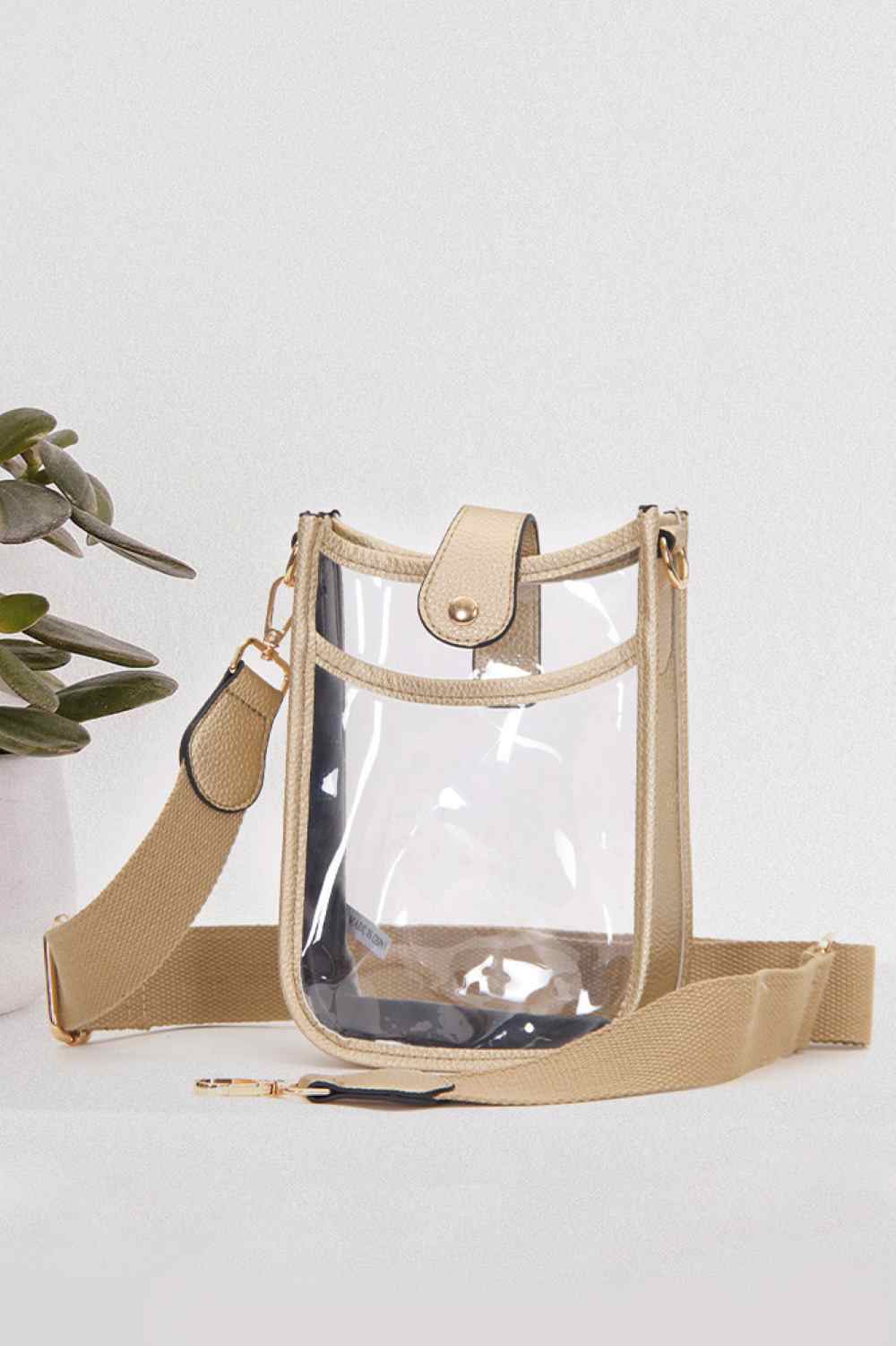 Gold Perfect for concert season and stadium events, this clear crossbody mini bag meets all venue security requirements while keeping your essentials within reach. Crafted from durable 100% PVC, it's easy to clean and built to last through countless outings. Compact yet functional at 8" x 5.8" x 2.3", the adjustable crossbody strap sits comfortably across your body, leaving your hands free. The transparent design lets you quickly locate your phone, keys, and small valuables at a glance.