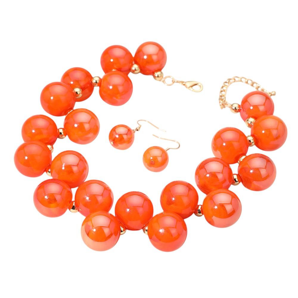 Orange chunky iridescent ball beaded necklace elevates any outfit with its unique and eye-catching design. The perfectly placed beads create a glamorous and statement-making accessory. Crafted with quality materials, this necklace is a must-have for any fashion enthusiast. 