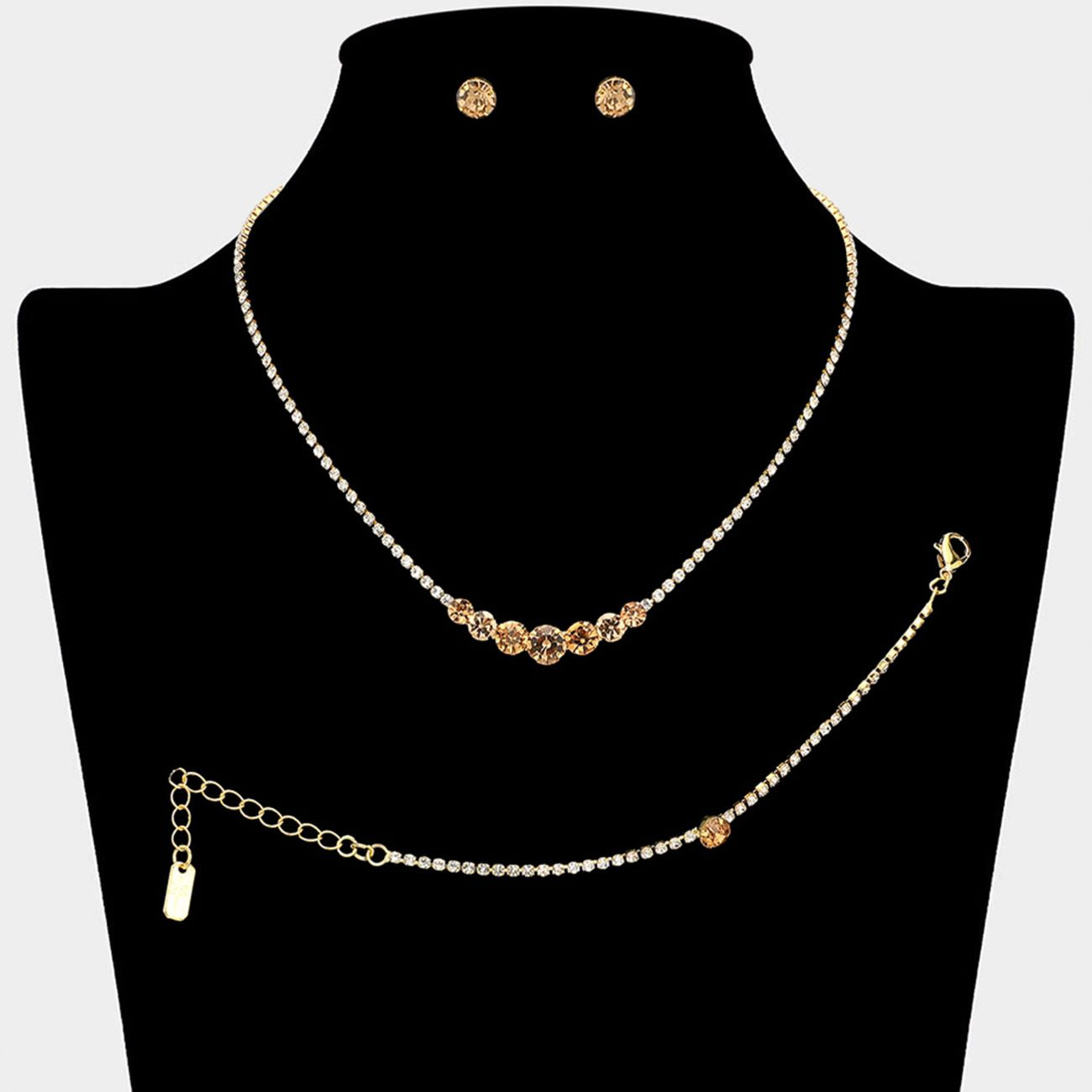 Gold, Lt Col Topaz Timeless matching necklace, stud earring, and bracelet set designed with a clean round stone centerpiece for effortless elegance. Ideal for weddings, formal events, parties, and everyday special occasion styling. A versatile set that delivers refined sparkle and coordinated sophistication.