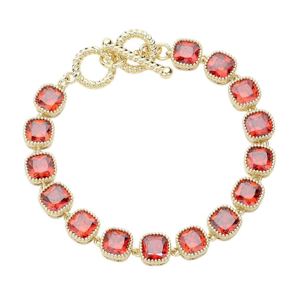 Gold Red 14K Gold Plated Square CZ Stone Link Evening Toggle Bracelet adds a touch of elegance to any outfit. The sparkling CZ stones and sturdy toggle clasp make it the perfect accessory for special occasions. Enjoy the luxurious look and feel of this high-quality bracelet