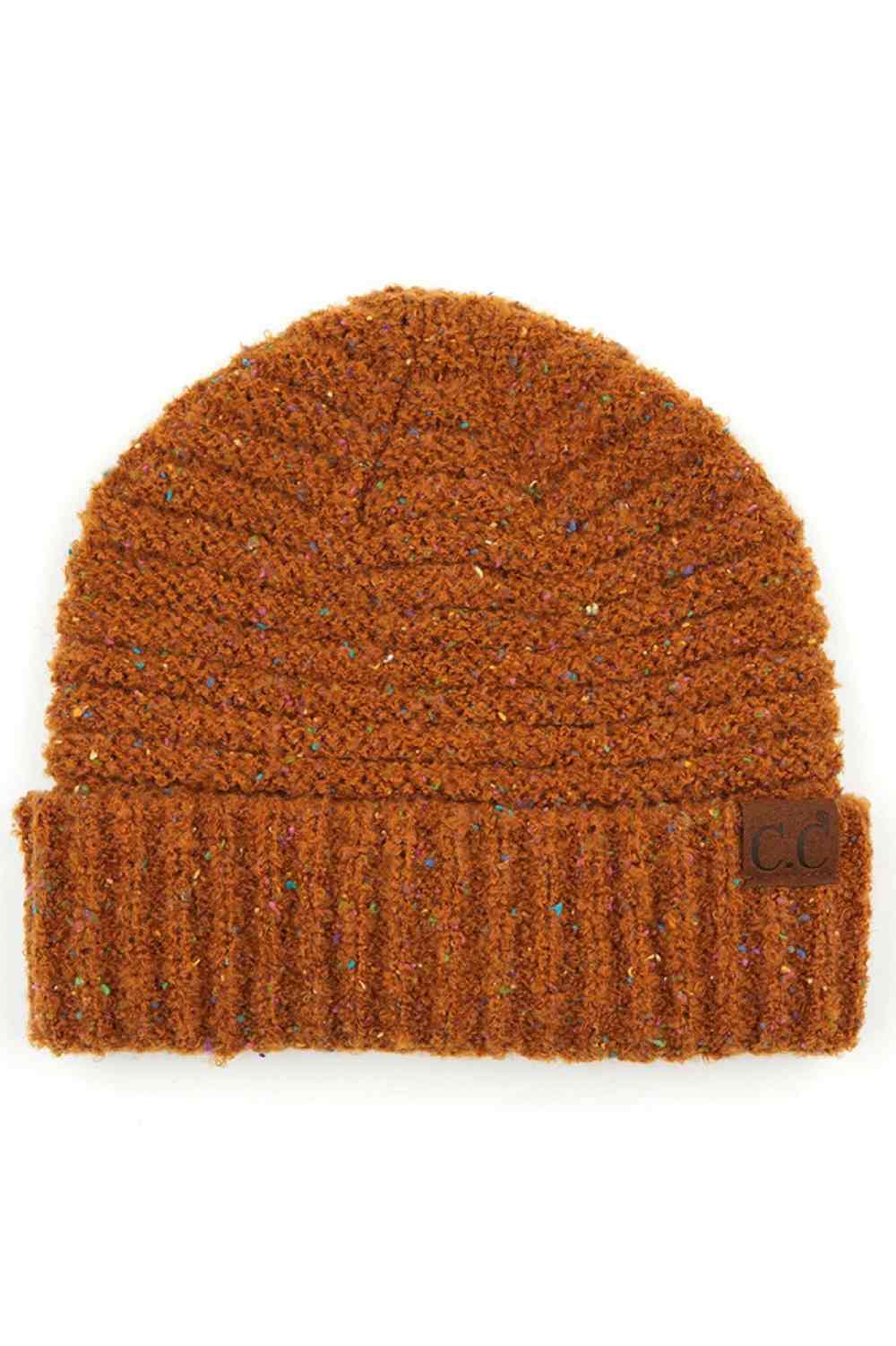 Golden Camel Elevate your winter wardrobe with this C.C Confetti Boucle Yarn Beanie, crafted from a premium blend of 95% polyester and 5% cotton. The textured boucle yarn creates visual interest and dimension, making it the perfect accessory to complement any outfit.