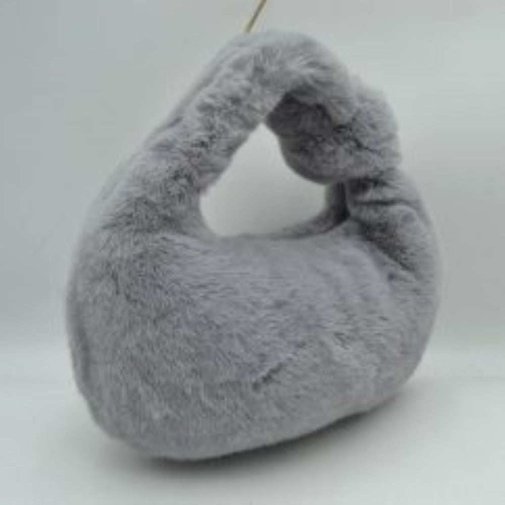 Gray This hobo-style handbag features a distinctive fluffy, textured plush exterior that wraps entirely around the body and handle for a soft finish. Designed for effortless everyday use, it showcases a curved crescent silhouette with a wide, integrated top handle that fits comfortably in the hand or on the arm. An open-top entry provides quick access to the main storage compartment, making it a playful yet practical accessory for carrying daily essentials.