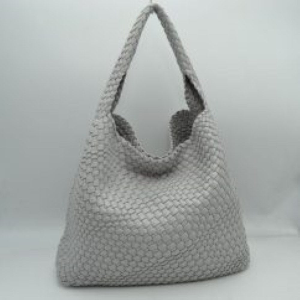 Gray This chic, slouchy shoulder bag features an intricate basket-weave design in a creamy off-white tone, offering a highly textured and relaxed silhouette for stylish everyday use. It is crafted with an integrated wide, woven top handle that extends seamlessly from the main body panels for comfortable over-the-shoulder carrying. The spacious open-top main compartment provides effortless access to your items and comes complete with a matching