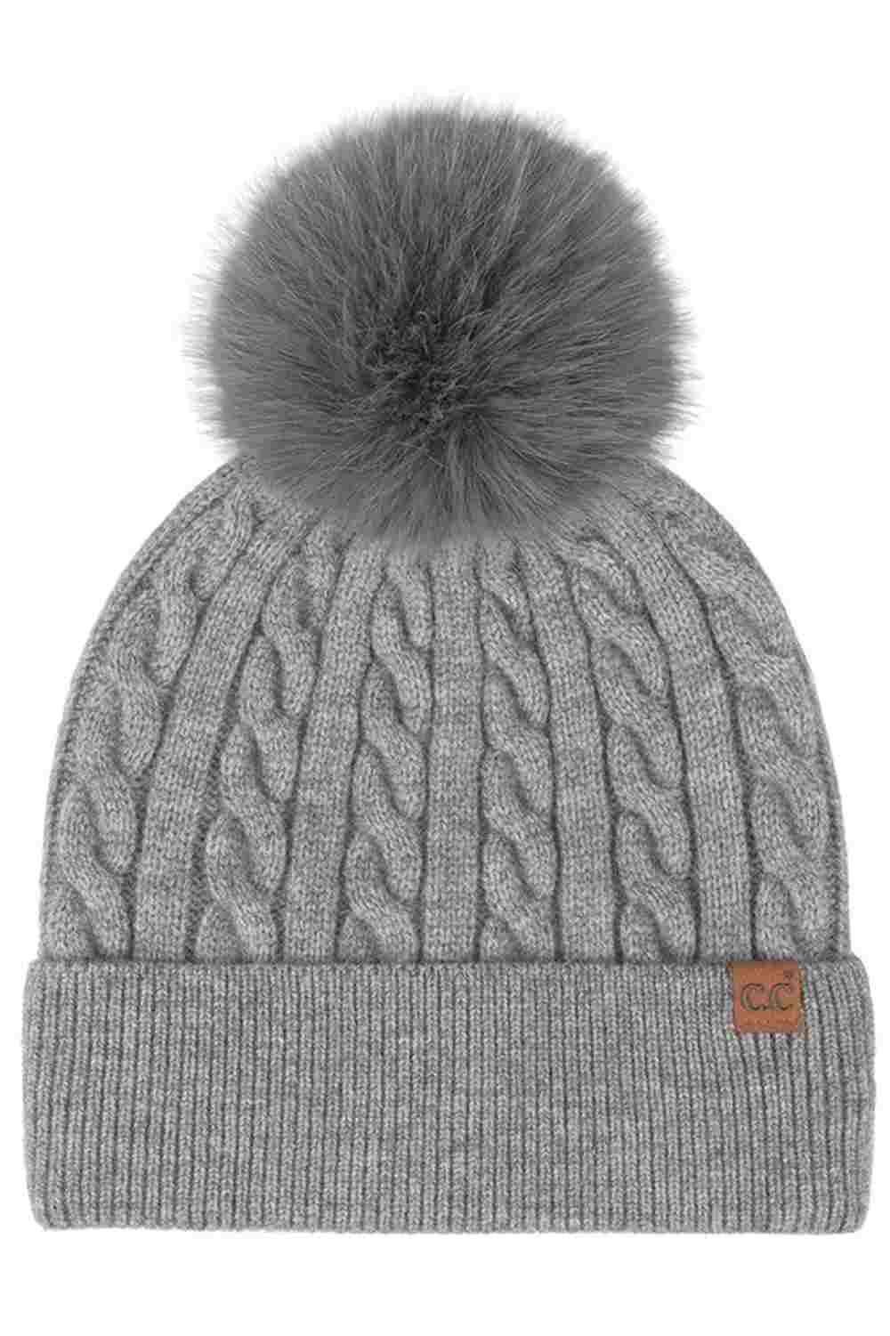 Gray C.C Cable Knit Pattern Pom and Cuff Beanie Hat features a classic cable-knit texture topped with a fluffy pom for a cozy, timeless winter look. Finished with a soft cuff and stretch fit, it keeps you warm and comfortable while adding effortless style to cold-weather outfits.