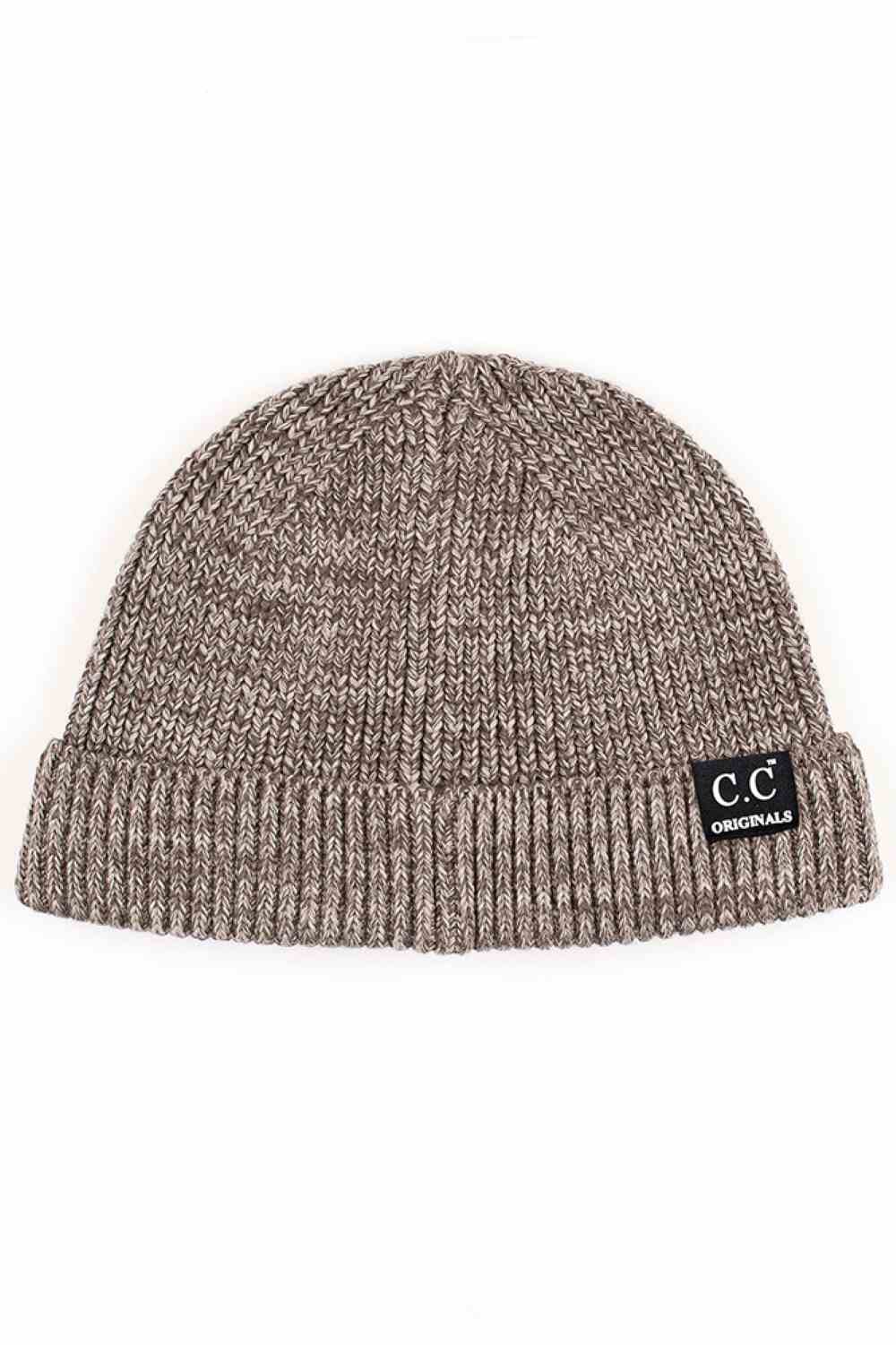Gray The C.C Mixed Tone Short Beanie combines comfort and style with its thoughtfully blended fabric of 45% cotton and 55% acrylic. This versatile beanie delivers warmth without bulk, making it ideal for layering through transitional seasons and everyday wear. The mixed-tone construction adds visual interest while remaining neutral enough to coordinate with any outfit.&nbsp;