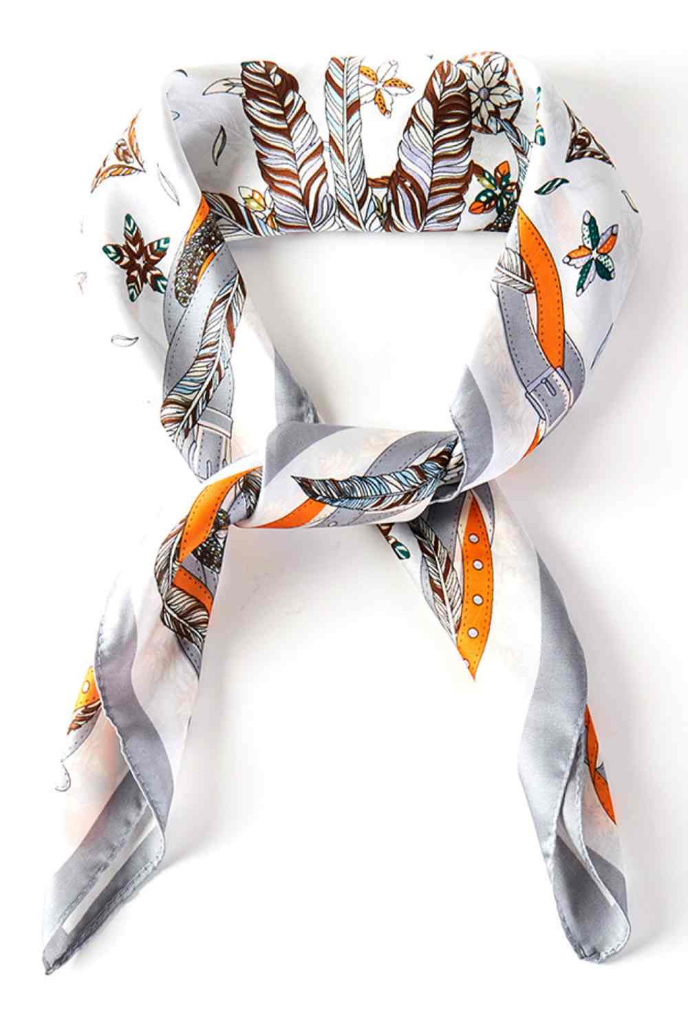 Gray Elevate your summer style with this versatile bandana square scarf, featuring a striking feather and belt print design. Crafted from lightweight 100% polyester, it's perfect for tying around your neck, wearing as a headwrap, or accessorizing your hair. The generous 27.5" x 27.5" size offers endless styling possibilities. Whether you're heading to the beach, a festival, or simply want to add a pop of pattern to your everyday look, this scarf delivers effortless sophistication and comfort all season long