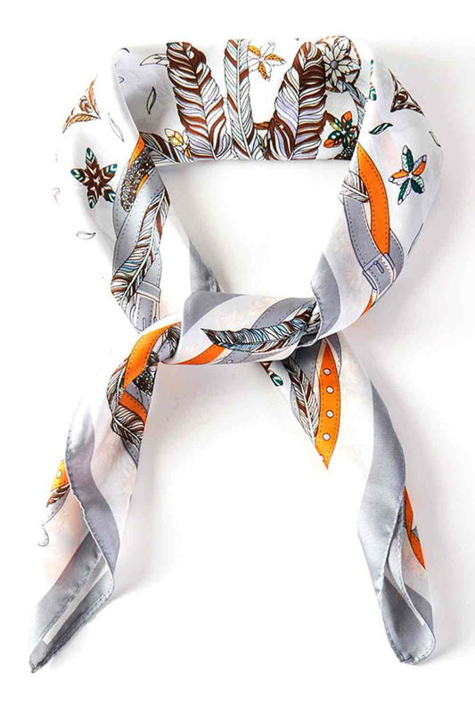 Gray Elevate your summer style with this versatile bandana square scarf, featuring a striking feather and belt print design. Crafted from lightweight 100% polyester, it's perfect for tying around your neck, wearing as a headwrap, or accessorizing your hair. The generous 27.5" x 27.5" size offers endless styling possibilities. Whether you're heading to the beach, a festival, or simply want to add a pop of pattern to your everyday look, this scarf delivers effortless sophistication and comfort all season long