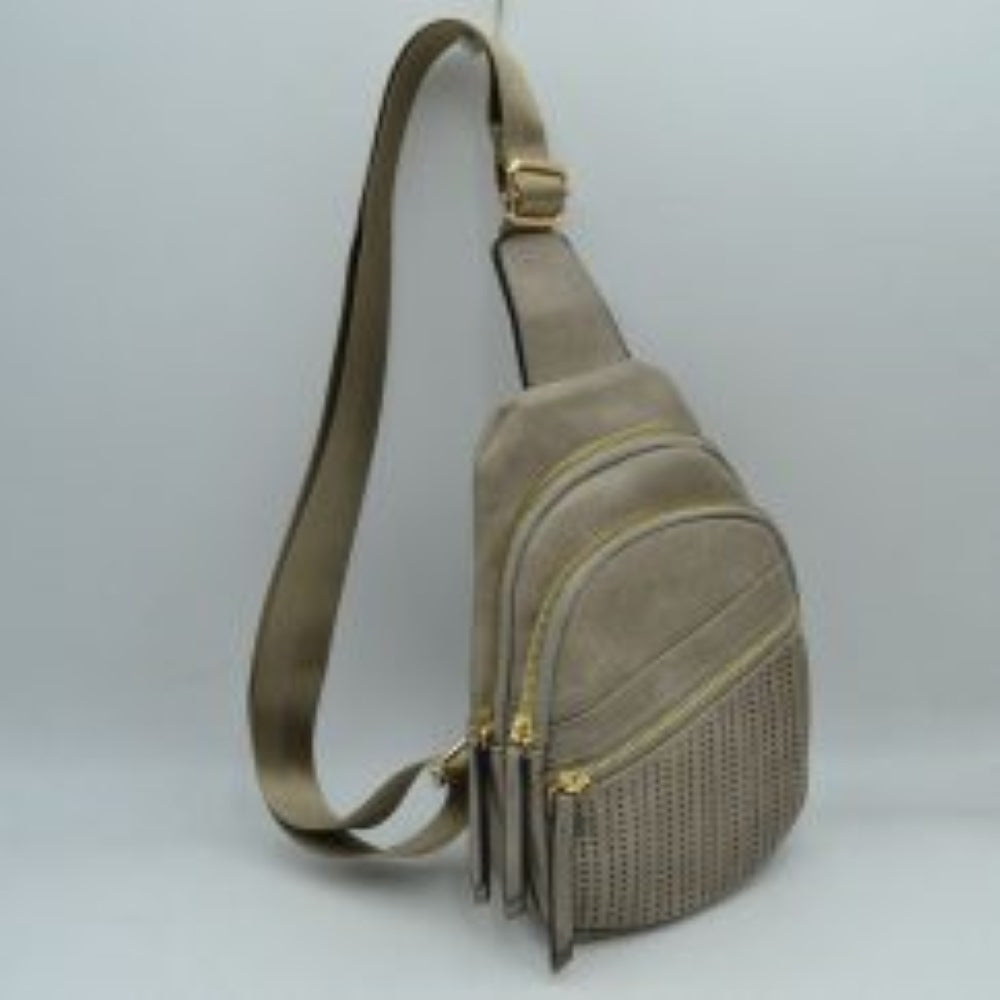 Gray This functional sling bag features a textured, grained finish with a multi-tiered silhouette engineered for organized everyday use. It provides multiple distinct storage compartments, including a primary curved main section, an intermediate arched pouch, and a lower pocket featuring a horizontal zipper closure and a decorative perforated design. The bag is completed by a single wide