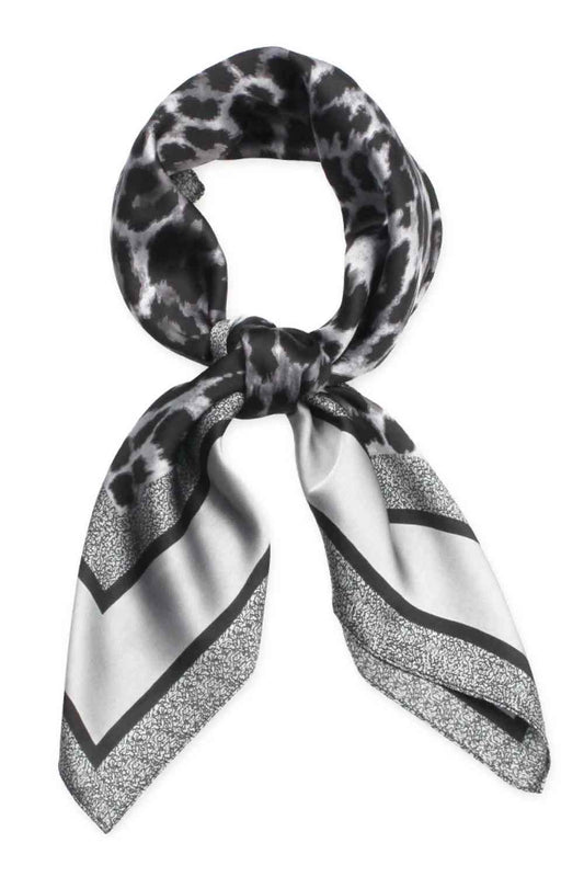 Gray Elevate your accessory game with this luxurious leopard pattern satin square scarf. The timeless animal print adds instant sophistication to any outfit, whether draped around your neck, tied as a headscarf, or styled as a chic belt accent. Crafted from 100% polyester with a smooth satin finish, this scarf offers a silky-soft feel against your skin while maintaining its shape and sheen. The generous 27.5" x 27.5" dimensions provide versatile styling options for endless looks. 