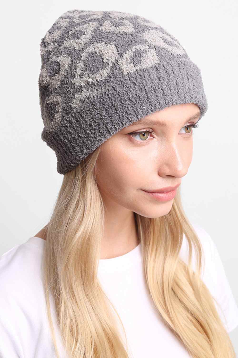 Gray Leopard Print with Ribbed Trim Beanie features a bold leopard print design accented with a ribbed trim for a stylish, trendy winter look. Made with a soft stretch fit, it provides cozy warmth while adding playful flair to your cold-weather outfits.