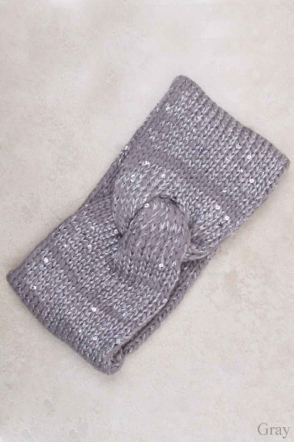 Gray Elevate your winter style with this charming two-color knit paired with a sparkling spangle headband. The soft, cozy knit features a classic color-block design, while the embellished headband adds a touch of glamour and personality. Perfect for staying warm without sacrificing style, this coordinated set brings effortless sophistication to any cold-weather look. Whether you're heading out for a casual day or a special occasion, this combination delivers comfort and eye-catching appeal.