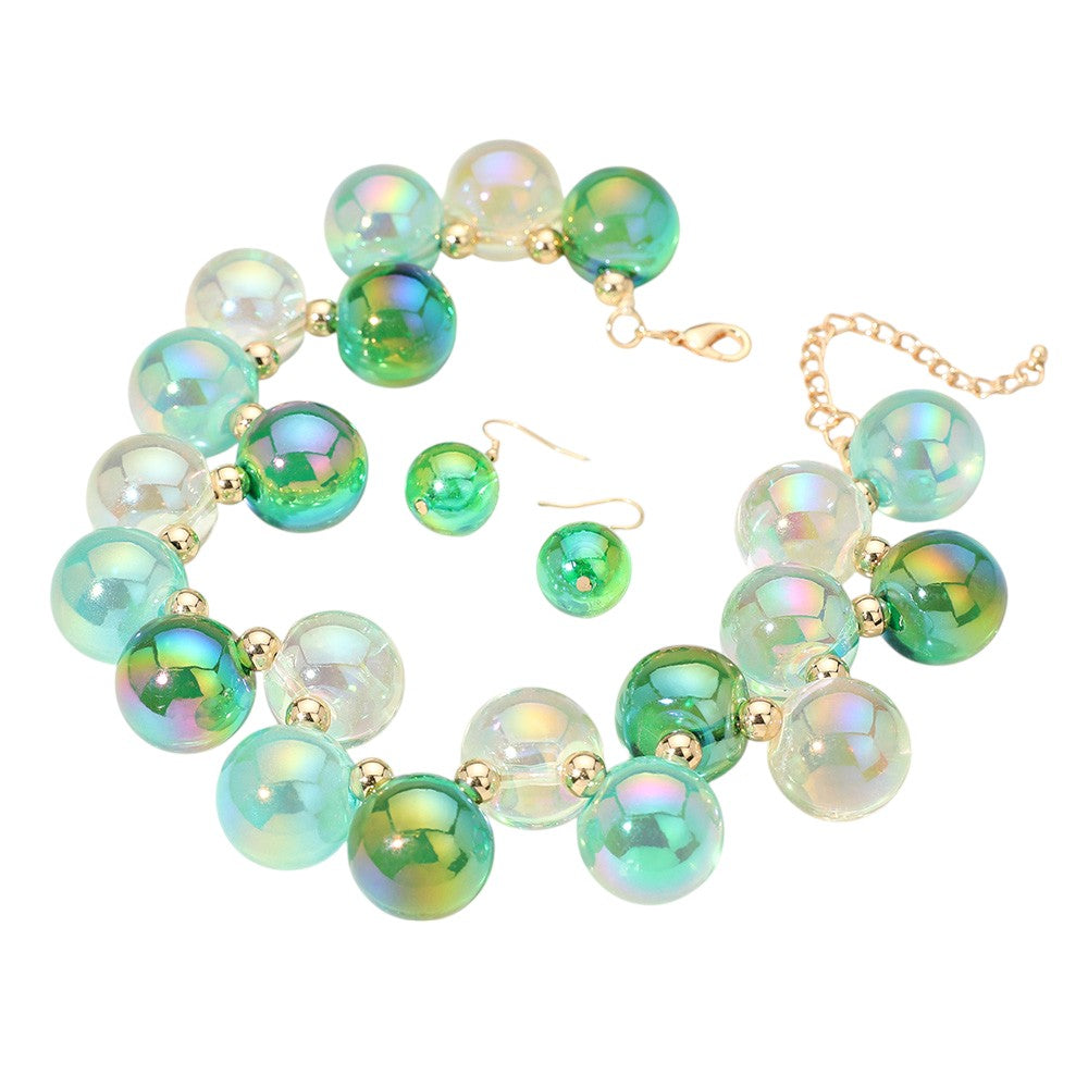 Grren chunky iridescent ball beaded necklace elevates any outfit with its unique and eye-catching design. The perfectly placed beads create a glamorous and statement-making accessory. Crafted with quality materials, this necklace is a must-have for any fashion enthusiast. 