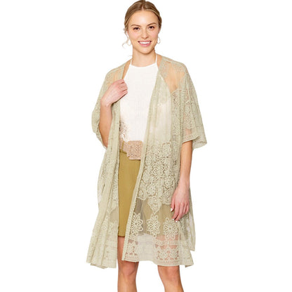 green Flower Lace Kimono Poncho is a versatile and fashionable addition to any wardrobe. The delicate lace detailing adds a touch of elegance, while the kimono style allows for comfortable and easy wear. Perfect for dressing up any outfit, this poncho is a must-have for any fashion-forward individual. 