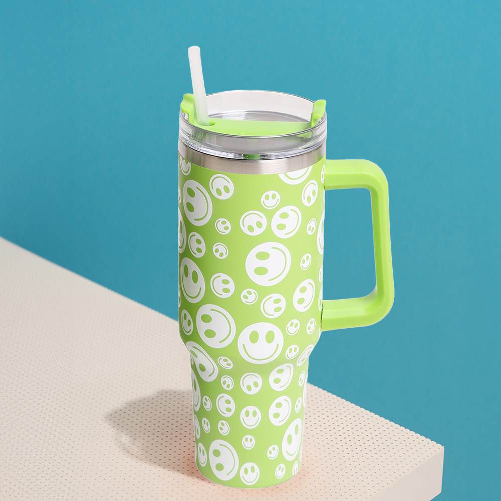Green Happy Face Printed 40oz Stainless Steel Tumbler With Handle is perfect for keeping your drinks hot or cold for hours. Made of durable stainless steel and featuring a fun happy face print, this tumbler is a great addition to your drinkware collection. With its large 40oz capacity and convenient handle, you can enjoy your favorite beverages on the go while spreading joy and happiness.