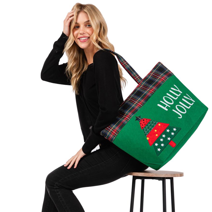 Celebrate the season with this “HOLLY JOLLY” tote bag featuring a cheerful Christmas tree design and plaid accents. Spacious and fun, it’s ideal for shopping, gifting, or carrying holiday essentials in festive style. A perfect companion for seasonal cheer.