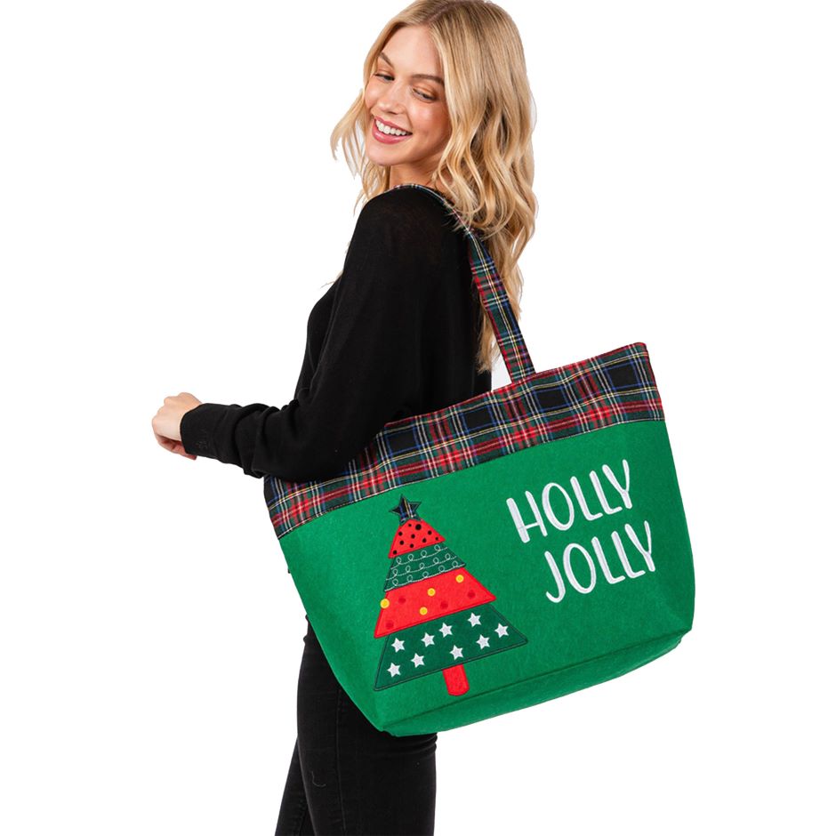 Celebrate the season with this “HOLLY JOLLY” tote bag featuring a cheerful Christmas tree design and plaid accents. Spacious and fun, it’s ideal for shopping, gifting, or carrying holiday essentials in festive style. A perfect companion for seasonal cheer.