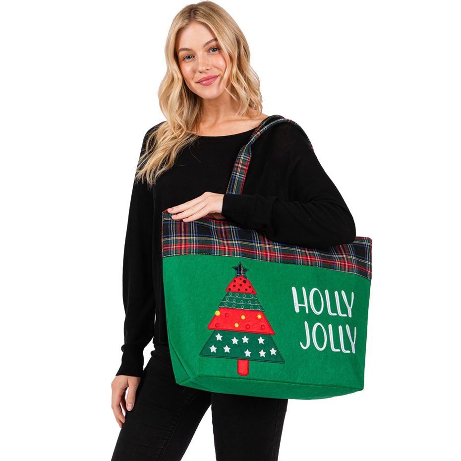 Celebrate the season with this “HOLLY JOLLY” tote bag featuring a cheerful Christmas tree design and plaid accents. Spacious and fun, it’s ideal for shopping, gifting, or carrying holiday essentials in festive style. A perfect companion for seasonal cheer.