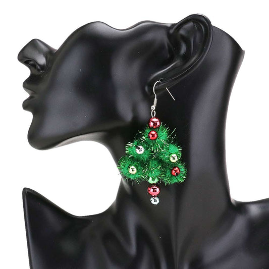 Green Pom Pom Christmas Tree Dangle Earrings, are beautifully designed with a pom pom theme that will make a glowing touch on everyone. These beautiful earrings are the ultimate representation of your class & beauty. These are the perfect gift for Christmas, especially for your friends, family, and the persons you love.