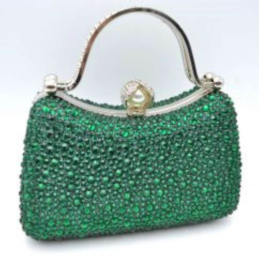 Green This elegant evening clutch bag features a structured silhouette heavily encrusted with shimmering black rhinestones, offering a highly textured and glamorous look for formal events. A sleek, curved metallic top handle lined with delicate crystals rises over the frame for a secure grip, anchored by polished spherical accents. The secure metal frame is highlighted by a prominent decorative clasp featuring a large faux pearl wrapped in rhinestone-studded detailing